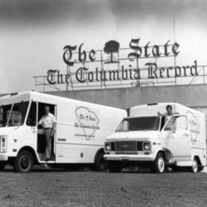 Delivery trucks in front of The State Newspaper