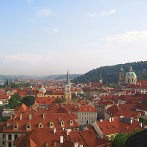 View of red roof tops and the spires of several churches